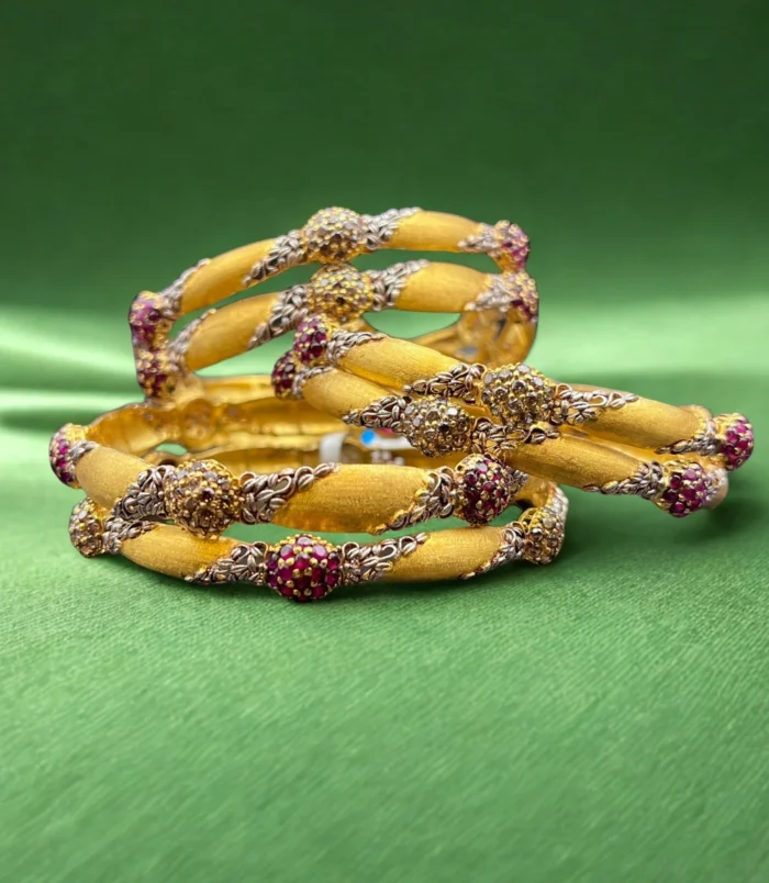gold and ruby bangles, luxury jewelry, wedding bangles, ruby jewelry, gold bangles with ruby accents, traditional bangles, elegant bangles, jewelry for special occasions